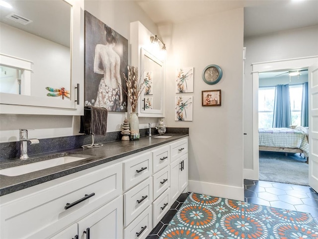 22795 Cterling Dr, Kingfisher, OK 73750 - bathroom with ensuite bath, double vanity, and tile patterned floors