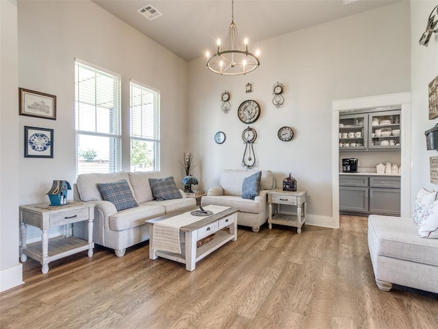22795 Cterling Dr, Kingfisher, OK 73750 - living room with light wood finished floors and a chandelier