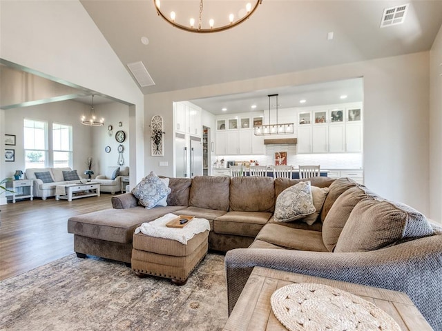 22795 Cterling Dr, Kingfisher, OK 73750 - living room with a chandelier, high vaulted ceiling, wood finished floors, and recessed lighting