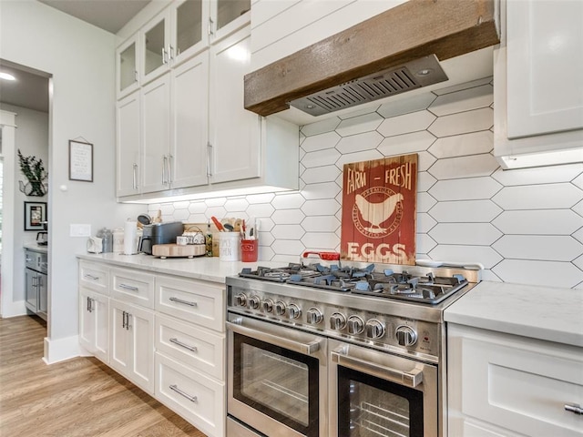 22795 Cterling Dr, Kingfisher, OK 73750 - kitchen with double oven range, custom range hood, tasteful backsplash, and white cabinets