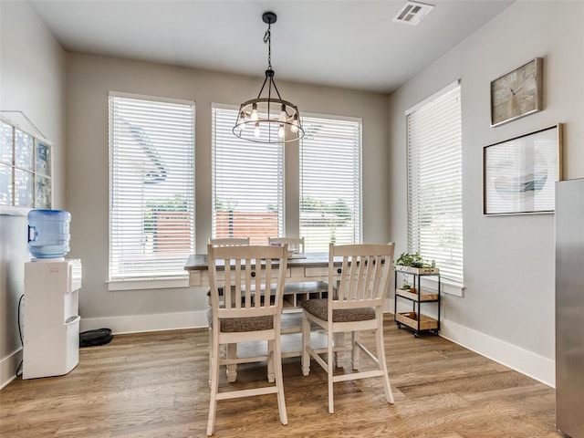22795 Cterling Dr, Kingfisher, OK 73750 - dining space featuring a chandelier and light wood-type flooring