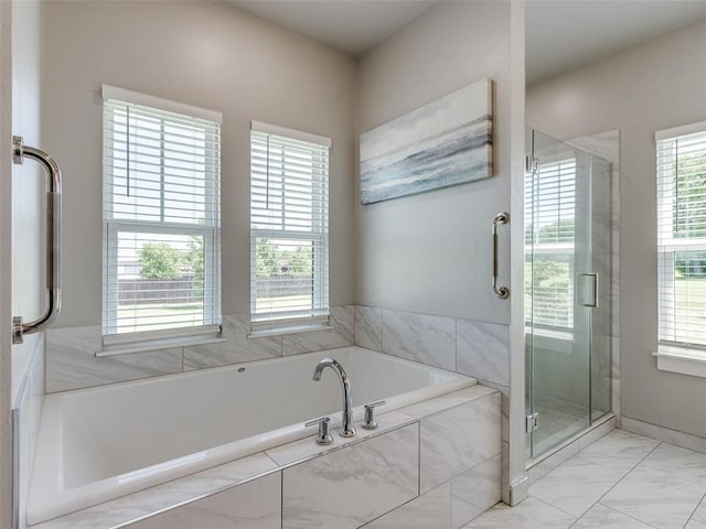 22795 Cterling Dr, Kingfisher, OK 73750 - bathroom featuring a stall shower, a bath, and marble look tiles