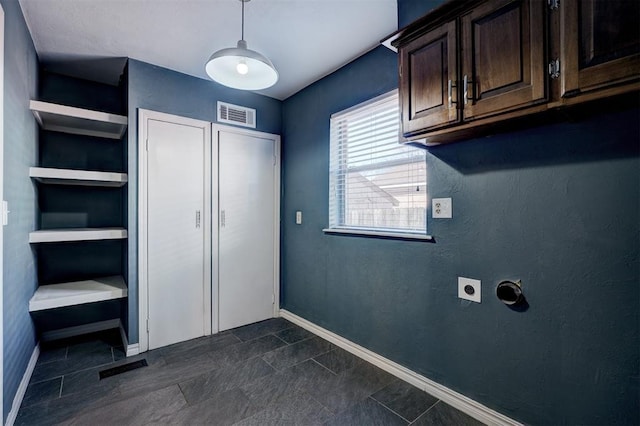 3208 NW 47th St, Oklahoma City, OK 73112 - washroom with hookup for an electric dryer and cabinet space