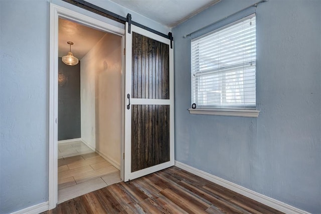 3208 NW 47th St, Oklahoma City, OK 73112 - foyer featuring dark wood-type flooring and a barn door
