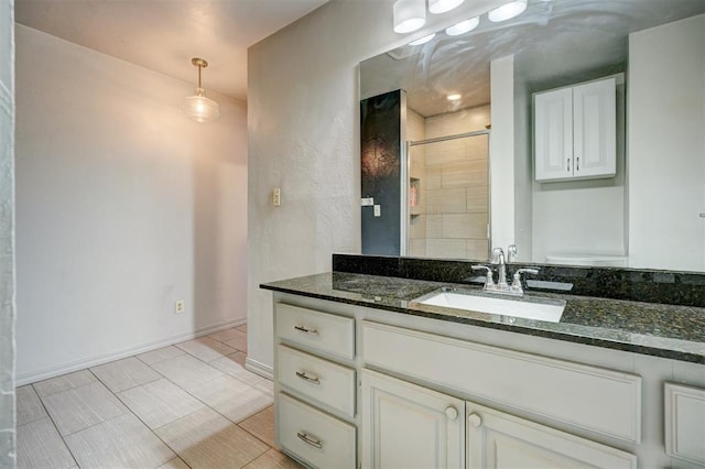 3208 NW 47th St, Oklahoma City, OK 73112 - bathroom featuring vanity, a tile shower, and tile patterned flooring