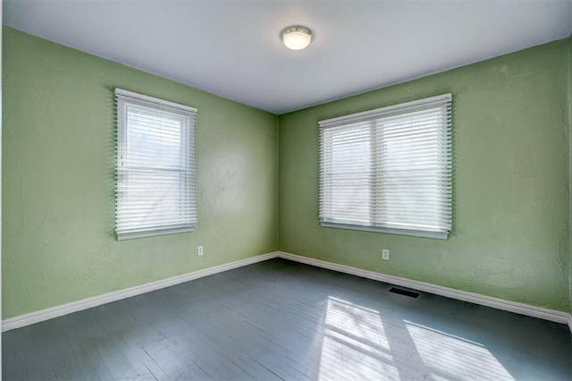 3208 NW 47th St, Oklahoma City, OK 73112 - spare room featuring plenty of natural light and wood finished floors