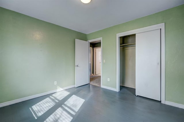 3208 NW 47th St, Oklahoma City, OK 73112 - unfurnished bedroom with dark wood-type flooring and a closet