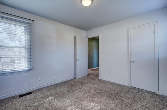 3208 NW 47th St, Oklahoma City, OK 73112 - unfurnished bedroom featuring carpet flooring and multiple windows
