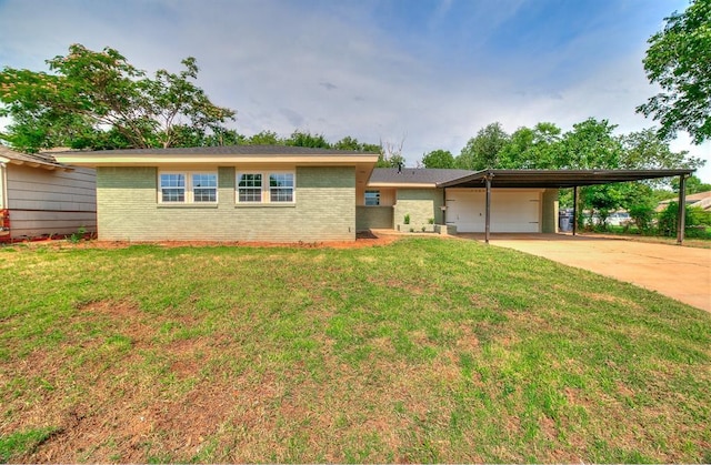 5309 S Blackwelder Ave, Oklahoma City, OK 73119 - ranch-style home featuring brick siding, an attached garage, a front lawn, and concrete driveway