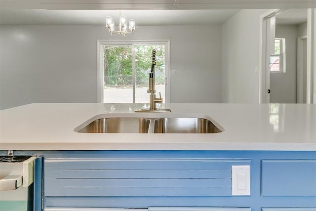 5309 S Blackwelder Ave, Oklahoma City, OK 73119 - kitchen featuring light countertops and a chandelier