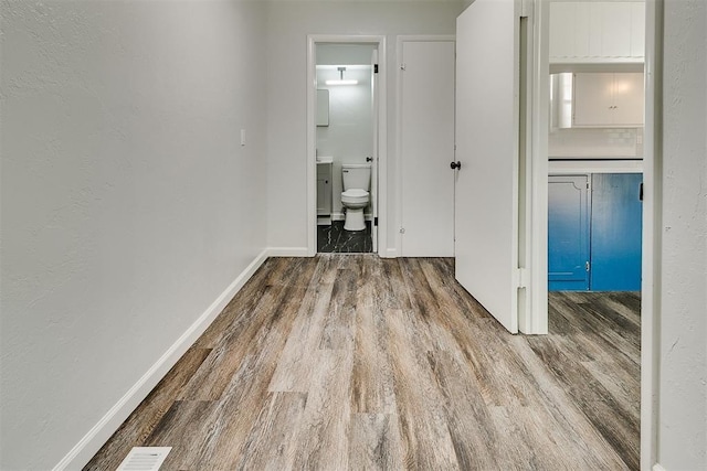 5309 S Blackwelder Ave, Oklahoma City, OK 73119 - corridor featuring wood finished floors and baseboards