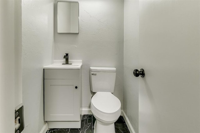 5309 S Blackwelder Ave, Oklahoma City, OK 73119 - half bathroom with vanity and marble finish flooring