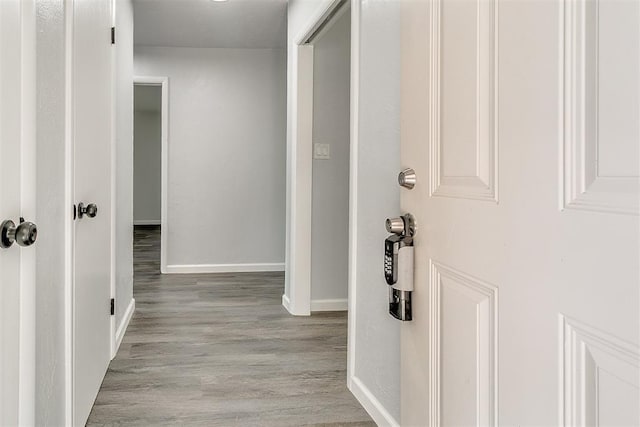 5309 S Blackwelder Ave, Oklahoma City, OK 73119 - hallway featuring baseboards and wood finished floors