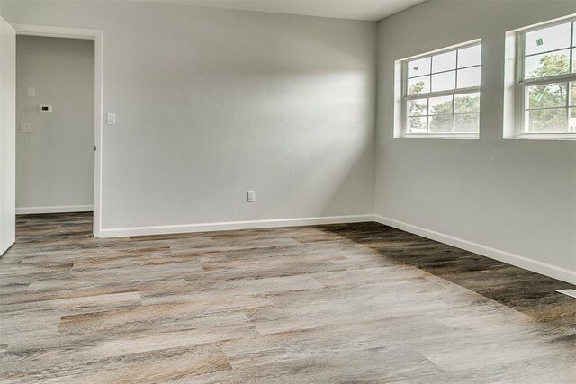 5309 S Blackwelder Ave, Oklahoma City, OK 73119 - empty room featuring wood finished floors and baseboards
