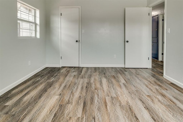 5309 S Blackwelder Ave, Oklahoma City, OK 73119 - spare room featuring wood finished floors and baseboards