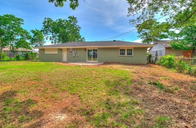 5309 S Blackwelder Ave, Oklahoma City, OK 73119 - back of property with a fenced backyard, brick siding, and a patio