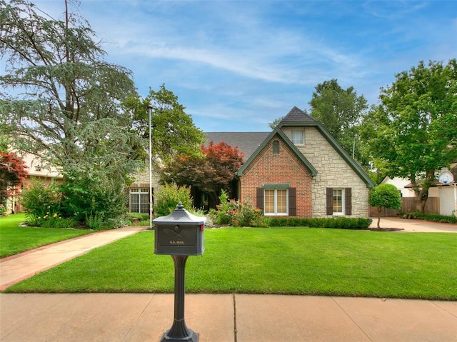 4304 Riders Mark, Edmond, OK 73025 - view of front of property with stone siding and a front yard