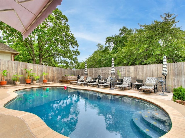 4304 Riders Mark, Edmond, OK 73025 - view of swimming pool with a fenced backyard and a patio