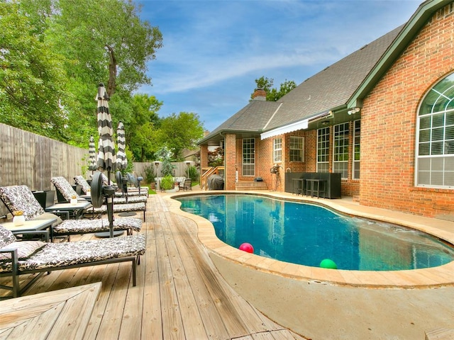 4304 Riders Mark, Edmond, OK 73025 - view of swimming pool with a fenced backyard, an outdoor hangout area, a patio area, and a wooden deck