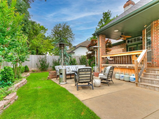4304 Riders Mark, Edmond, OK 73025 - fenced backyard with a ceiling fan, an outdoor hangout area, and a patio