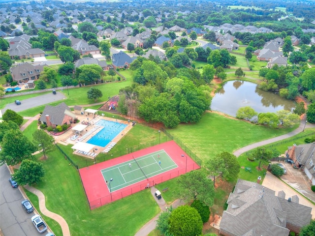 4304 Riders Mark, Edmond, OK 73025 - aerial view of residential area with a nearby body of water and a pool area