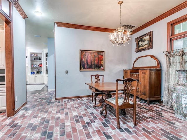4304 Riders Mark, Edmond, OK 73025 - dining room featuring a chandelier, crown molding, brick floors, and built in features