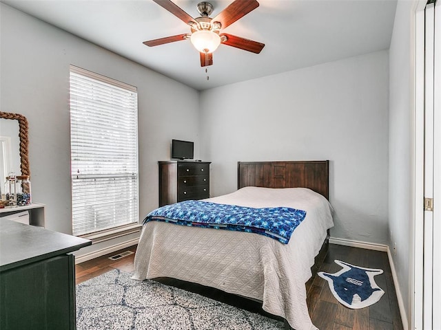 4304 Riders Mark, Edmond, OK 73025 - bedroom with wood finished floors and a ceiling fan