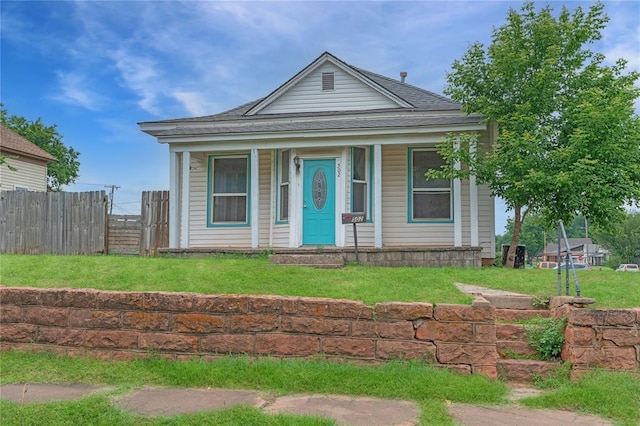 502 S 7th St, Chickasha, OK 73018 - view of front of house featuring a porch and a shingled roof