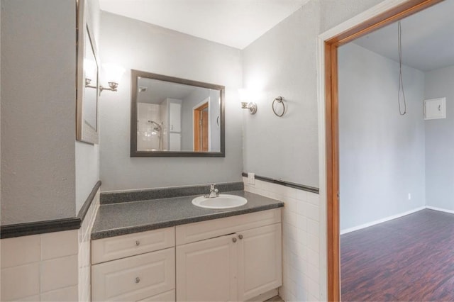 502 S 7th St, Chickasha, OK 73018 - bathroom with vanity and wood finished floors