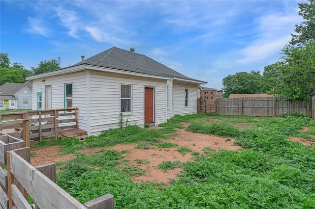 502 S 7th St, Chickasha, OK 73018 - rear view of house with a fenced backyard