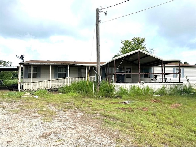 1194 County Street 2955 St, Tuttle, OK 73089 - view of front of property with covered porch and a carport