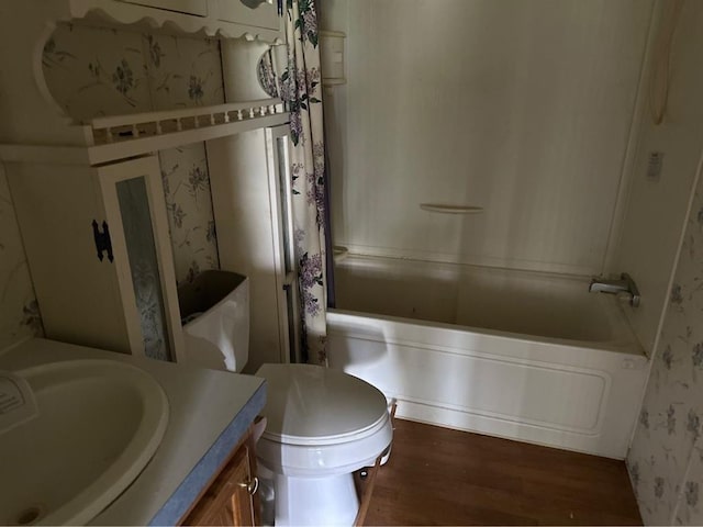 1194 County Street 2955 St, Tuttle, OK 73089 - bathroom with wallpapered walls, wood finished floors, shower / bathtub combination with curtain, and vanity