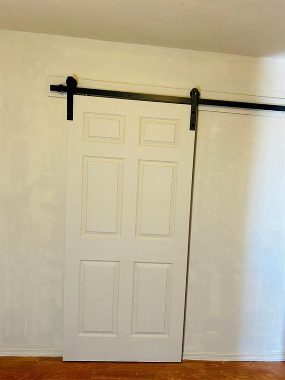 202 W Oak Ave, Seminole, OK 74868 - detailed view of a barn door and wood finished floors