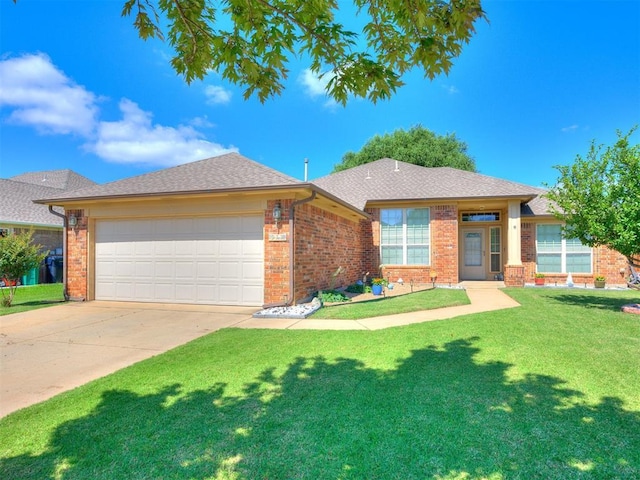 517 Firefork Ave, Yukon, OK 73099 - view of front of home with brick siding, an attached garage, a front yard, concrete driveway, and roof with shingles