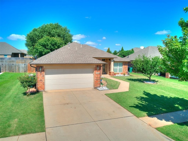 517 Firefork Ave, Yukon, OK 73099 - ranch-style house featuring brick siding, concrete driveway, roof with shingles, and an attached garage