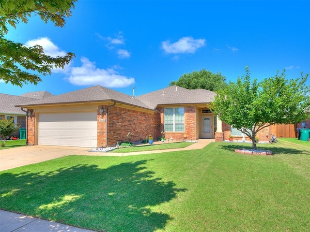 517 Firefork Ave, Yukon, OK 73099 - single story home featuring brick siding, a garage, a front lawn, and driveway