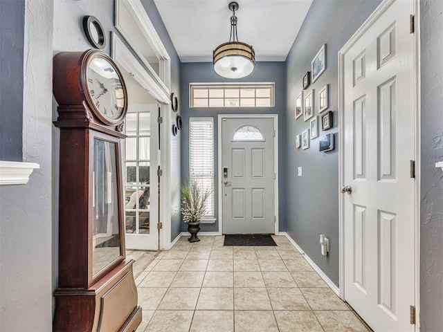 517 Firefork Ave, Yukon, OK 73099 - entryway with light tile patterned floors and baseboards