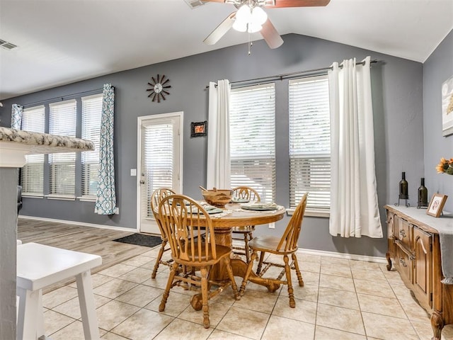 517 Firefork Ave, Yukon, OK 73099 - dining area featuring a ceiling fan, vaulted ceiling, and light tile patterned floors