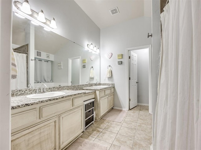 517 Firefork Ave, Yukon, OK 73099 - bathroom featuring double vanity and tile patterned floors