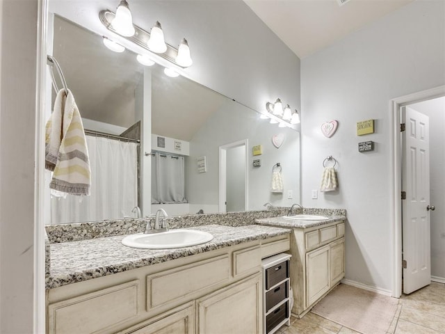 517 Firefork Ave, Yukon, OK 73099 - bathroom featuring vanity, tile patterned floors, and lofted ceiling