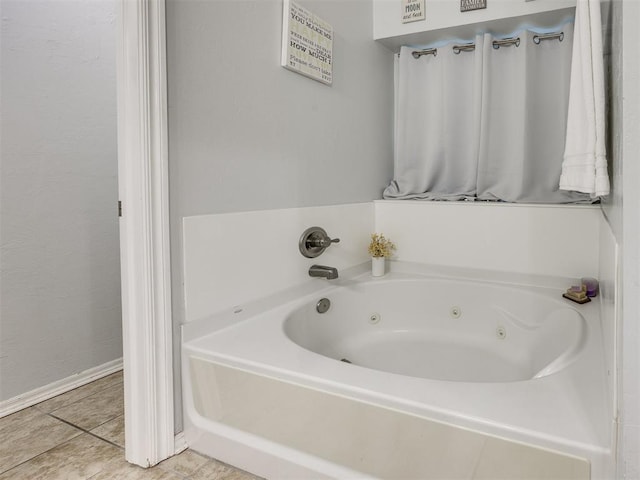 517 Firefork Ave, Yukon, OK 73099 - bathroom with a jetted tub and tile patterned flooring