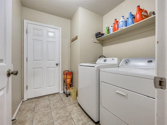 517 Firefork Ave, Yukon, OK 73099 - laundry area featuring independent washer and dryer and light tile patterned flooring