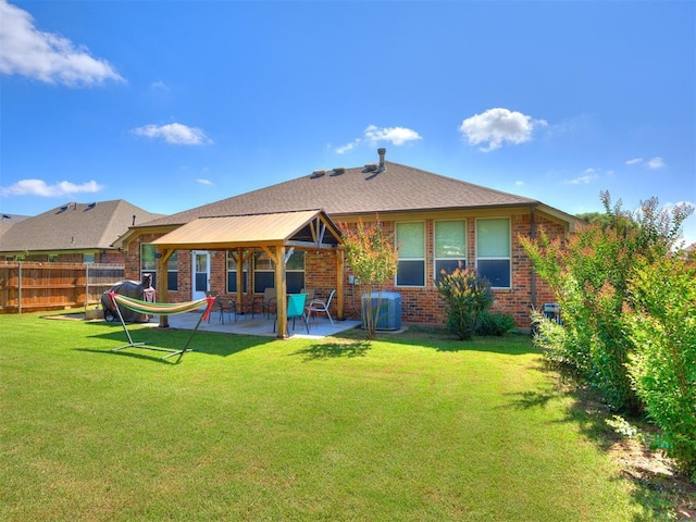 517 Firefork Ave, Yukon, OK 73099 - back of property with brick siding, a patio, and a gazebo