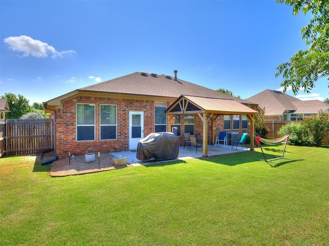 517 Firefork Ave, Yukon, OK 73099 - back of property with a gazebo, a patio, a fenced backyard, and brick siding