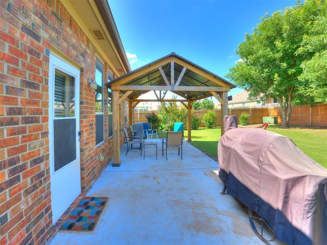 517 Firefork Ave, Yukon, OK 73099 - fenced backyard with a gazebo, a patio, and grilling area
