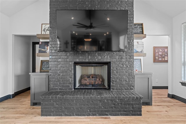 1031 Colonial Ave, Tuttle, OK 73089 - detailed view of wood finished floors, a brick fireplace, and ceiling fan