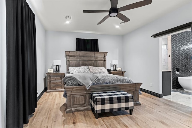 1031 Colonial Ave, Tuttle, OK 73089 - bedroom with light wood-style flooring, recessed lighting, a ceiling fan, and connected bathroom
