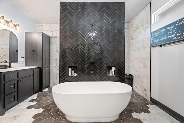 1031 Colonial Ave, Tuttle, OK 73089 - full bathroom with tile walls, a freestanding tub, and vanity