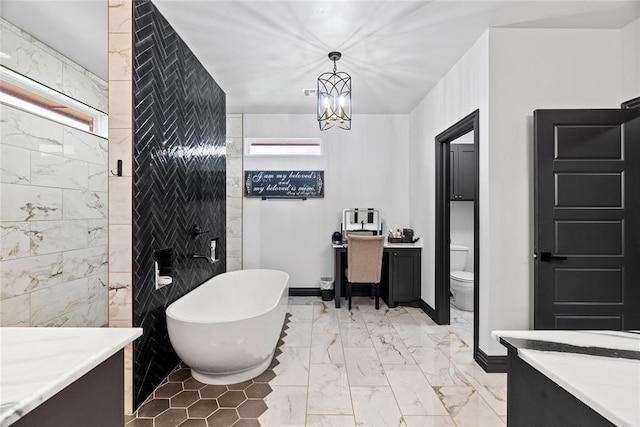 1031 Colonial Ave, Tuttle, OK 73089 - full bathroom featuring a freestanding tub, vanity, a chandelier, and marble finish flooring