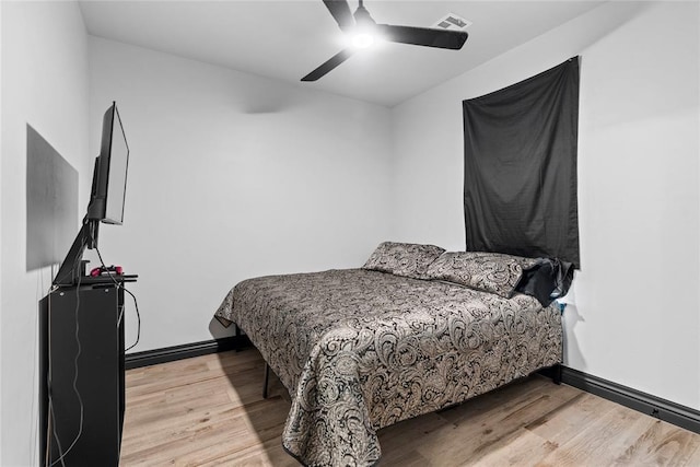 1031 Colonial Ave, Tuttle, OK 73089 - bedroom featuring wood finished floors and a ceiling fan